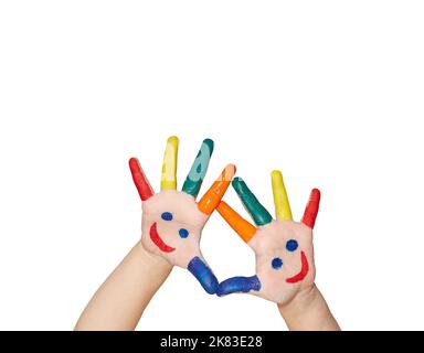 Children's palms cheerfully painted with paint on a white background with copy space. Card for birthday or holiday invitation. Stock Photo