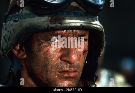Jason Isaacs Film: Black Hawk Down (USA/UK 2001) Characters: Steele  Director: Ridley Scott 18 December 2001   **WARNING** This Photograph is for editorial use only and is the copyright of SCOTT FREE PRODUCTIONS and/or the Photographer assigned by the Film or Production Company and can only be reproduced by publications in conjunction with the promotion of the above Film. A Mandatory Credit To SCOTT FREE PRODUCTIONS is required. The Photographer should also be credited when known. No commercial use can be granted without written authority from the Film Company. Stock Photo