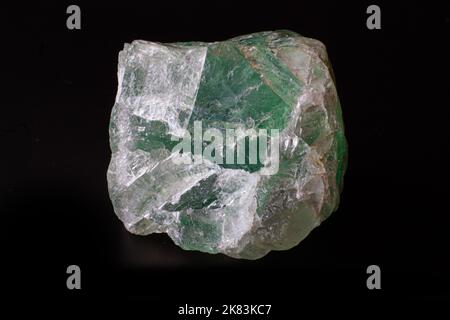 Macro rough green fluorite stone  isolated on black surface Stock Photo