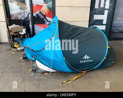 London, UK. 19th October, 2022. A homeless person sleeps in their tent under a bridge on the Embankment oppsite the River Thames. As the cost of living crisis worsens, more people are becoming homeless. Credit: Maureen McLean/Alamy Stock Photo