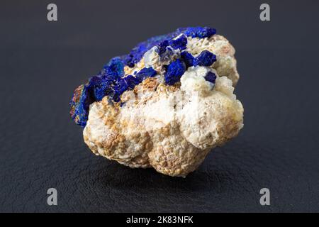 Macro blue azurite cluster on white matrix isolated crystal on black background Stock Photo