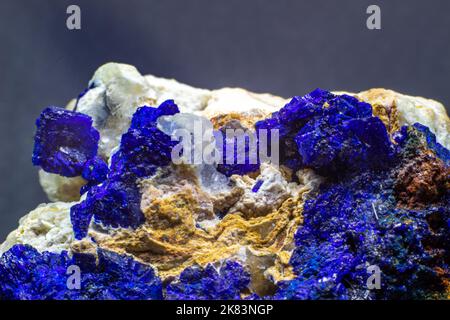 Macro blue azurite cluster on white matrix isolated crystal on black background Stock Photo