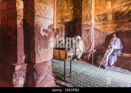 TIGRAY, ETHIOPIA - MARCH 22, 2019: Priests in Abuna Abraham Debre Tsion rock church in Tigray region, Ethiopia