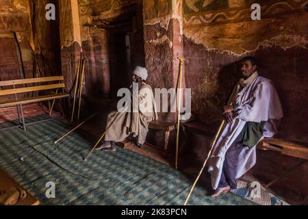 TIGRAY, ETHIOPIA - MARCH 22, 2019: Priests in Abuna Abraham Debre Tsion rock church in Tigray region, Ethiopia