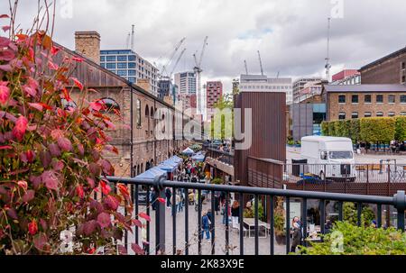 The Drops Market people walking under the lights in Coal Drops Yard, King's Cross Stock Photo