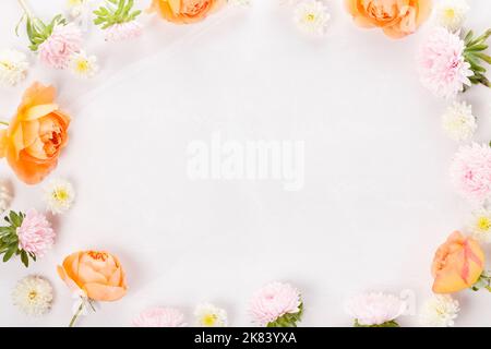 Autumn creative composition roses, hydrangea flowers on gray background. Stock Photo
