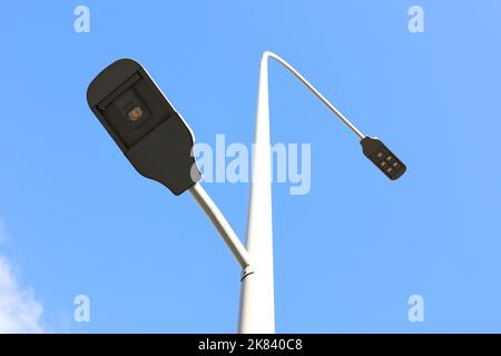 LED street lamp post on blue sky background. Led lights saving electrical energy Stock Photo