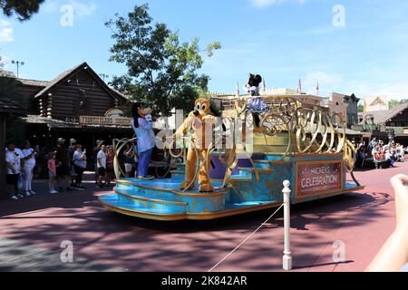 Minie, Goofy and Pluto from Mickeys world doing a celebration on a parade car in front of people (50 years celebration), Stock Photo Stock Photo