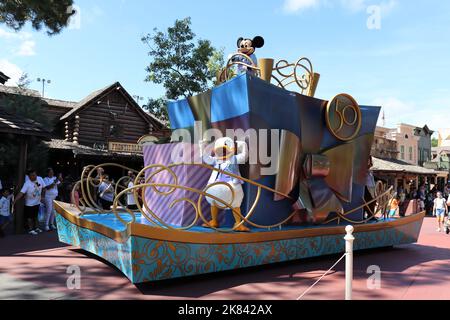 Donald Duck and Mickey Mouse doing a celebration on a parade car in front of people (50 years celebration), Stock Photo Stock Photo