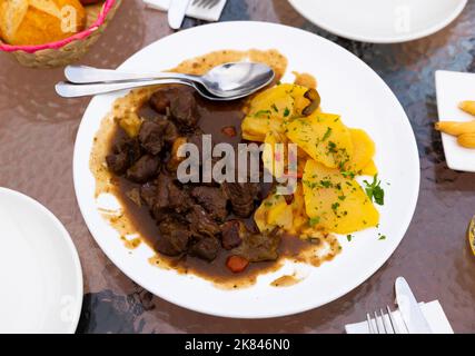 Venison ragout with port wine, thyme and mushroom aroma. Traditional dish of Toledo Stock Photo