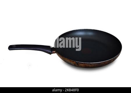 Old and dirty frying pan isolated on white background Stock Photo