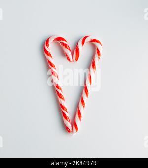Christmas composition made with Christmas candies on white background. Happy holidays. New Year minimal concept. Flat lay. Stock Photo