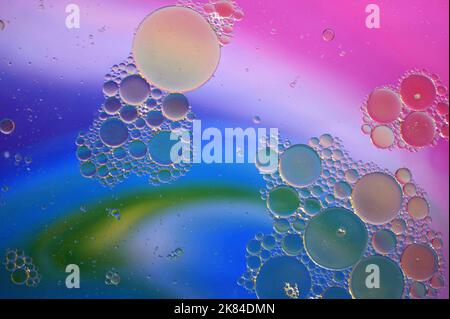 Water Drops on Rainbow Multicolored background Stock Photo