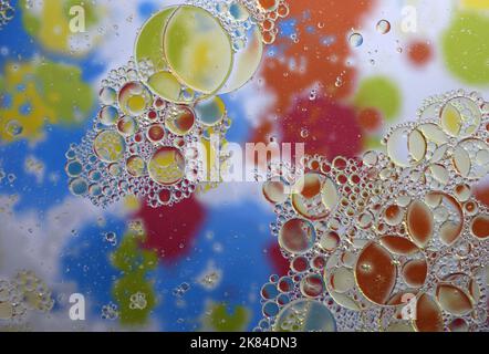 Water Drops on Rainbow Multicolored background Stock Photo