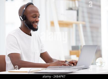 Sending out documents that could change the world. a male businessman working in a call center. Stock Photo