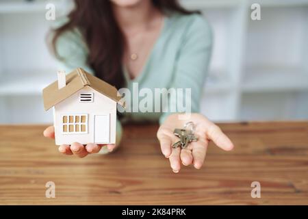 The customer holds the house model and keys Stock Photo - Alamy
