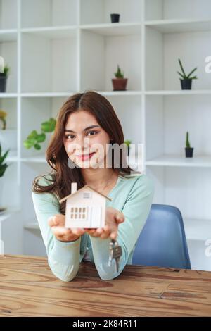 The customer holds the house model and keys Stock Photo - Alamy
