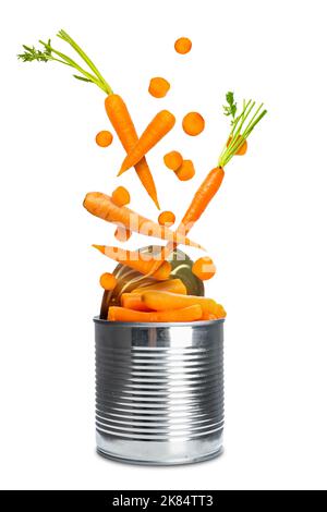 Open tin can with falling tasty carrots on white background Stock Photo