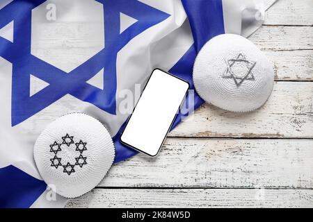 Flag of Israel, mobile phone and text SHABBAT SHALOM on wooden background  Stock Photo - Alamy