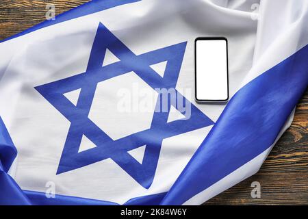 Flag of Israel, mobile phone and text SHABBAT SHALOM on wooden background  Stock Photo - Alamy