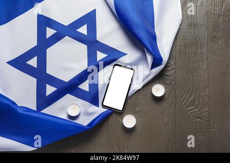 Flag of Israel, mobile phone and text SHABBAT SHALOM on wooden background  Stock Photo - Alamy