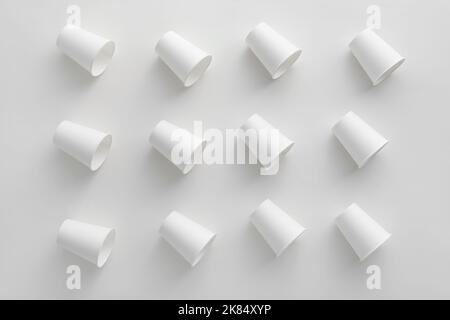 Pattern made of paper cups on white background Stock Photo