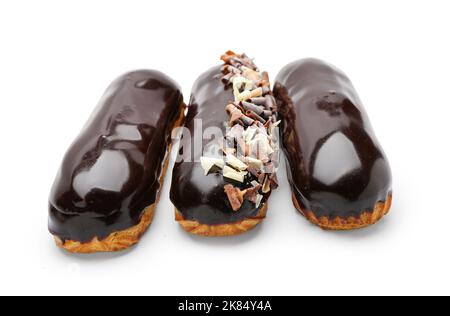 Delicious eclairs in chocolate glaze on white background Stock Photo