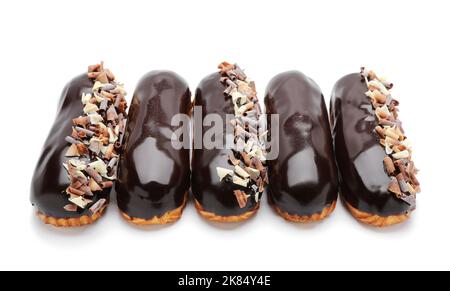 Delicious eclairs in chocolate glaze isolated on white background Stock Photo