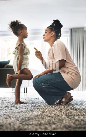 I discipline you because I care about you. a young mother reprimanding a child at home. Stock Photo