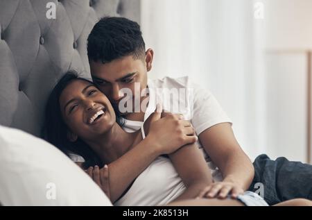 He makes me so happy. a young couple sharing an intimate moment at home. Stock Photo