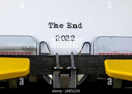 The End 2022 written on an old typewriter Stock Photo