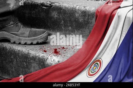 The leg of the military stands on the step next to the flag of Paraguay, the concept of military conflict Stock Photo