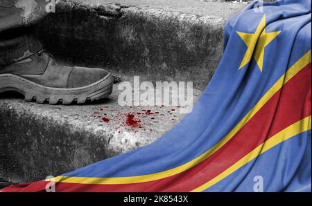 The leg of the military stands on the step next to the flag of Congo Democratic, the concept of military conflict Stock Photo