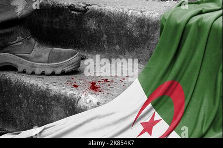 The leg of the military stands on the step next to the flag of Algeria, the concept of military conflict Stock Photo