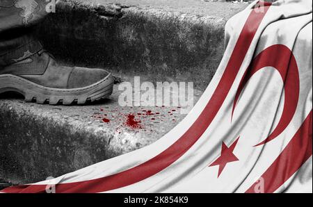 The leg of the military stands on the step next to the flag of Turkish Republic of Northern Cyprus, the concept of military conflict Stock Photo