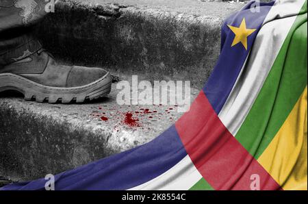 The leg of the military stands on the step next to the flag of Central African republic, the concept of military conflict Stock Photo