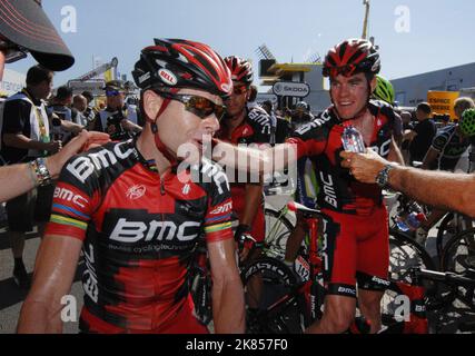 BMC Racing Team's Cadel Evans (L) celebrates with team mate Brent Bookwalter after finishing second in stage 1  Stock Photo