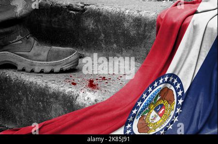 The leg of the military stands on the step next to the flag of State of Missouri, the concept of military conflict Stock Photo