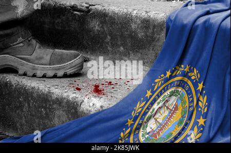 The leg of the military stands on the step next to the flag of State of New Hampshire, the concept of military conflict Stock Photo