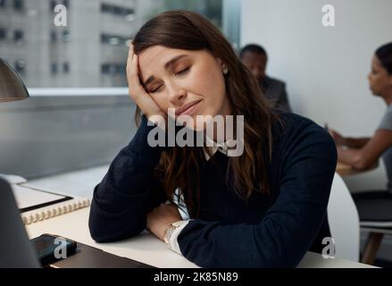 Just closing my eyes for a little while. a young businesswoman falling asleep at work. Stock Photo