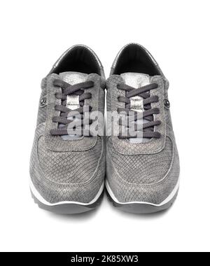 Gray female suede sneakers isolated on white background with clipping path Stock Photo
