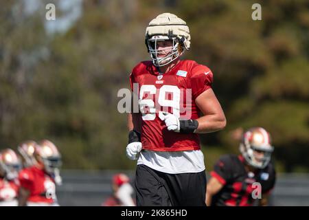 San Francisco 49ers Mike McGlinchey (69) walks on the field with a shirt  displaying Crucial Catch during an NFL football game against the Seattle  Seahawks, Sunday, October 3, 2021, in Santa Clara