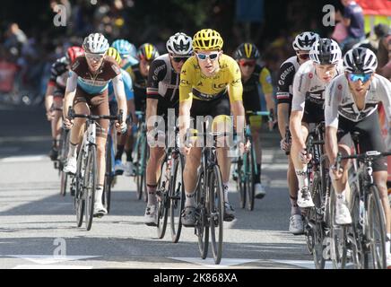 Geraint Thomas in yellow in the middle of the GC group arriving in Luchon during Stage 16 of the Tour de France 2018 from Carcassonne to Bagneres de Luchon. Stock Photo