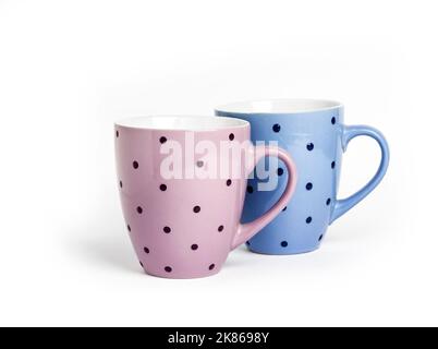 Pink and blue dotted mugs isolated on white background with copy space Stock Photo