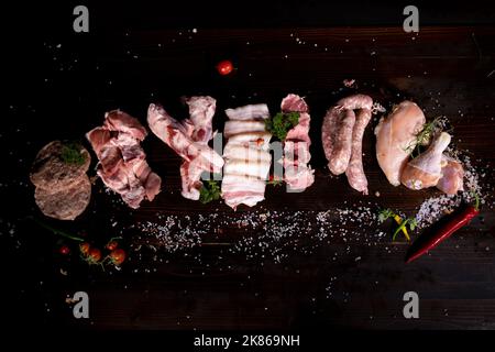 Various types of raw meat of beef, pork, chicken on a stone background  Stock Photo