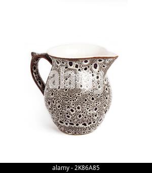 Glazed ceramic milk jar isolated on a white background Stock Photo