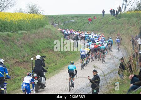 The chasing group during the second cobbled stage of racing Briastre a Viesly during the Paris - Roubaix race in Paris, France on April 14, 2019. Stock Photo