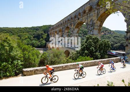 The break with Lukasz Wisniowski for CCC and Lars Bak Yiting , Stephane Rosetto for team Cofidis and Rein taaramae team Total Direct Energie navigate the Pont du Gard during the Tour de France 2019 Stage 16 - Nimes to Nimes Stock Photo