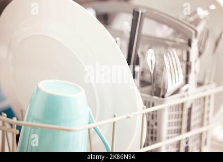 Its faster, cleaner and more convenient. clean dishes in a dishwasher. Stock Photo