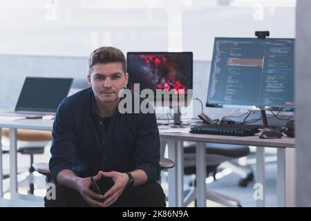 Programming. Man Working On Computer In IT Office, Sitting At Desk Writing Codes. Programmer Typing Data Code, Working On Project In Software Stock Photo